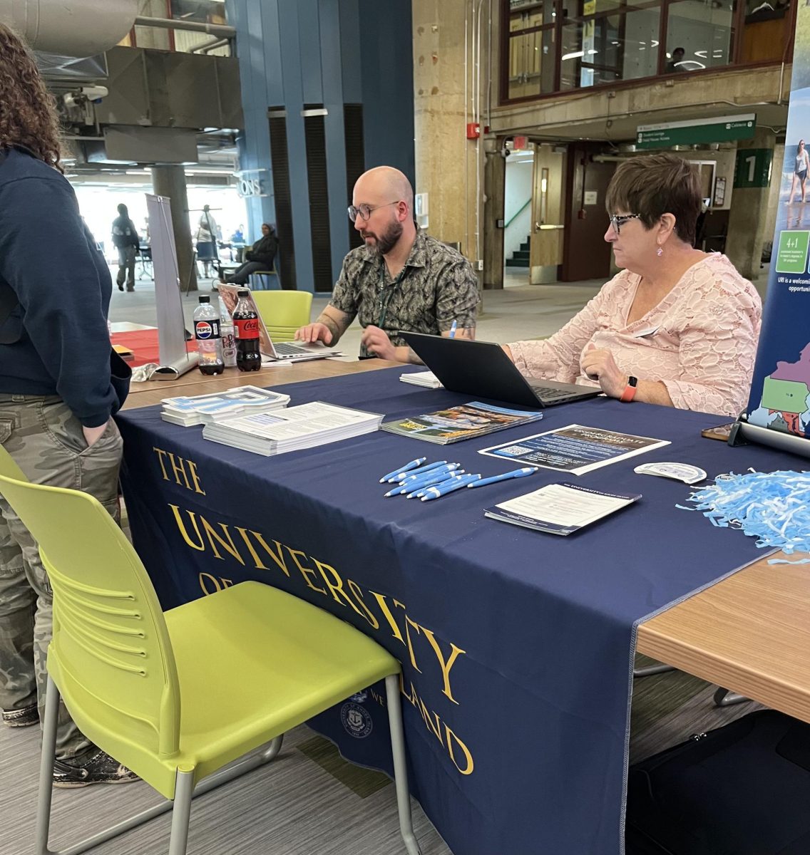 Joseph Bonaldi (left) with Nancy (right) from University of Rhode Island talking with student.